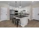 Modern kitchen with white cabinets and large island at 9237 E Sector Dr, Mesa, AZ 85212