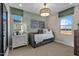 Bright bedroom with a daybed and plenty of natural light at 9237 E Sector Dr, Mesa, AZ 85212