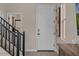 Bright entryway with modern staircase and art at 9237 E Sector Dr, Mesa, AZ 85212