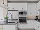 Modern kitchen features stainless steel appliances and a large island at 9237 E Sector Dr, Mesa, AZ 85212