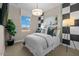 Stylish bedroom with a black and white accent wall at 9237 E Sector Dr, Mesa, AZ 85212