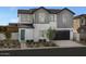 Two story home with gray siding and teal door at 9237 E Sector Dr, Mesa, AZ 85212