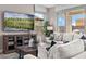 Living room with large TV and comfortable seating at 9237 E Sector Dr, Mesa, AZ 85212