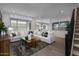 Spacious living room with sectional sofa and wood coffee table at 9237 E Sector Dr, Mesa, AZ 85212