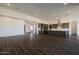 Modern kitchen features dark cabinetry, island, and stainless steel appliances at 3823 W Lodge Dr, Laveen, AZ 85339