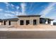 Stunning modern home with stone accents and a three-car garage at 3823 W Lodge Dr, Laveen, AZ 85339