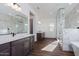 Spa-like bathroom with marble tile and walk-in shower at 3823 W Lodge Dr, Laveen, AZ 85339
