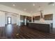 Open concept kitchen with an island, dark cabinets, and tile floors at 3823 W Lodge Dr, Laveen, AZ 85339