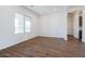 Spacious dining area with large window and adjacent hallway at 3823 W Lodge Dr, Laveen, AZ 85339