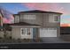 Two-story home with modern design and a two-car garage at 9233 E Sector Dr, Mesa, AZ 85212