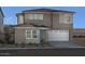 Two-story home with a modern facade and two-car garage at 9233 E Sector Dr, Mesa, AZ 85212