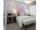 Charming bedroom featuring a bed, nightstands, and pretty wall decor at 9233 E Sector Dr, Mesa, AZ 85212