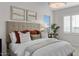 Bright and airy main bedroom with comfortable seating area at 9233 E Sector Dr, Mesa, AZ 85212