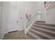 Elegant staircase with modern metal railing and carpeting at 9233 E Sector Dr, Mesa, AZ 85212