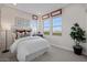 Comfortable bedroom with large windows and stylish decor at 9233 E Sector Dr, Mesa, AZ 85212