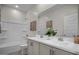 Clean bathroom with a double vanity, tub, and shower at 9233 E Sector Dr, Mesa, AZ 85212