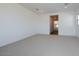 Large bedroom with carpet and access to bathroom at 3812 W Lodge Dr, Laveen, AZ 85339