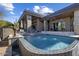 Luxury pool with fountain features and spacious patio at 10284 E Running Deer Trl, Scottsdale, AZ 85262