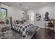 Main bedroom with cozy bedding, large artwork, and ensuite bath at 10284 E Running Deer Trl, Scottsdale, AZ 85262