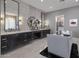 Spa-like bathroom with double vanities, large mirrors, and a walk-in closet at 10284 E Running Deer Trl, Scottsdale, AZ 85262