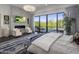 Comfortable main bedroom with sitting area and private access to a pool at 10284 E Running Deer Trl, Scottsdale, AZ 85262