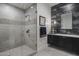 Modern bathroom with a large walk-in shower and floating vanity at 10284 E Running Deer Trl, Scottsdale, AZ 85262