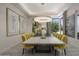 Formal dining room with large table and modern chandelier at 10284 E Running Deer Trl, Scottsdale, AZ 85262