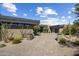 Modern desert home with paver driveway and drought-tolerant landscaping at 10284 E Running Deer Trl, Scottsdale, AZ 85262