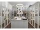 Huge walk-in closet with ample shelving and mirror doors at 10284 E Running Deer Trl, Scottsdale, AZ 85262