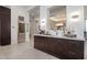 Custom wet bar with wine refrigerator and quartz countertops at 10284 E Running Deer Trl, Scottsdale, AZ 85262