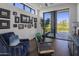 Home office with large window, hardwood floors, and built-in shelving at 10284 E Running Deer Trl, Scottsdale, AZ 85262