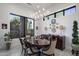 Elegant dining room with wood table and unique wall decor at 10284 E Running Deer Trl, Scottsdale, AZ 85262