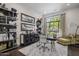 Spacious home office with large window and built-in shelving at 10284 E Running Deer Trl, Scottsdale, AZ 85262