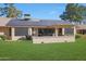 Home exterior showcasing solar panels and a pergola at 12911 W Blue Sky Dr, Sun City West, AZ 85375