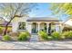 One-story home with arched entryway and well-manicured landscaping at 20431 W Lost Creek Dr, Buckeye, AZ 85396