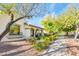 One-story home with a large window and nicely landscaped yard at 20431 W Lost Creek Dr, Buckeye, AZ 85396