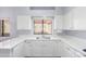 Bright eat-in kitchen with white cabinets and quartz countertops at 45 E 9Th Pl # 36, Mesa, AZ 85201