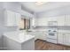 White kitchen with quartz countertops and appliances at 45 E 9Th Pl # 36, Mesa, AZ 85201