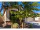 Charming house exterior with mature landscaping and stone accents at 1952 N 212Th Ln, Buckeye, AZ 85396