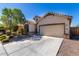 House exterior with driveway and landscaping at 1952 N 212Th Ln, Buckeye, AZ 85396
