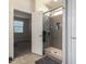 Bathroom with shower, tile flooring and a walk-in closet at 1952 N 212Th Ln, Buckeye, AZ 85396