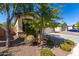 Landscaped front yard with mature trees at 1952 N 212Th Ln, Buckeye, AZ 85396