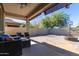 Spacious backyard with covered patio, fire pit, and basketball court at 1952 N 212Th Ln, Buckeye, AZ 85396