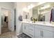 Modern bathroom with double vanity and large shower at 1952 N 212Th Ln, Buckeye, AZ 85396