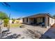 Large backyard with patio, fire pit, and basketball hoop at 1952 N 212Th Ln, Buckeye, AZ 85396