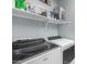 Clean laundry room featuring Whirlpool washer and dryer at 1952 N 212Th Ln, Buckeye, AZ 85396