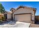 Two-story house exterior with attached garage and landscaping at 1952 N 212Th Ln, Buckeye, AZ 85396