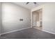 Bedroom with TV mount and access to hallway at 1952 N 212Th Ln, Buckeye, AZ 85396