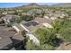 Aerial view of a house with solar panels and mountain views at 20431 W Lost Creek Dr, Buckeye, AZ 85396