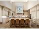 Gourmet kitchen with custom cabinetry, a large island, and decorative hood at 20567 N 112Th St, Scottsdale, AZ 85255